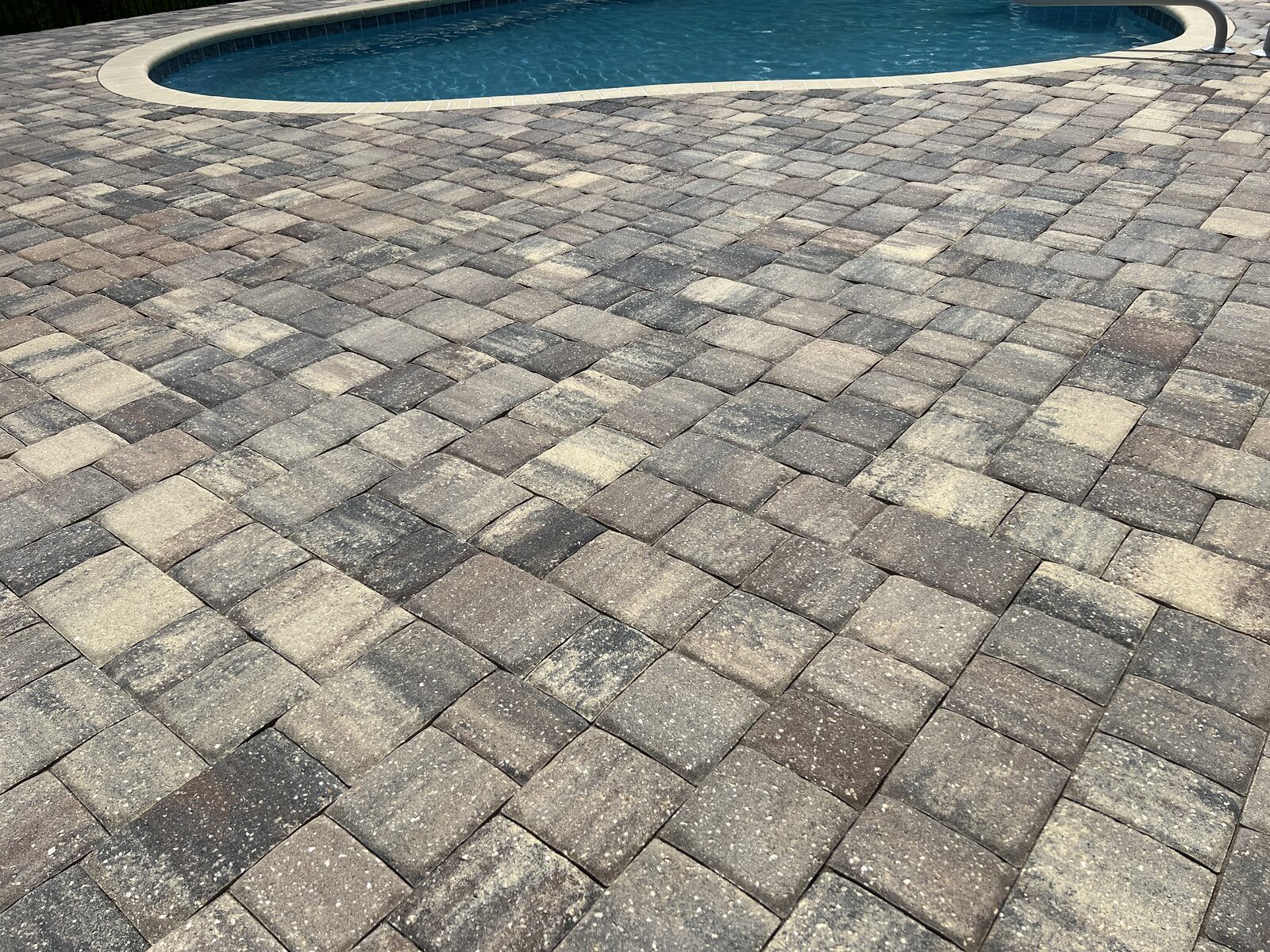 Clean paver pool deck after professional paver cleaning in Fernandina Beach, FL